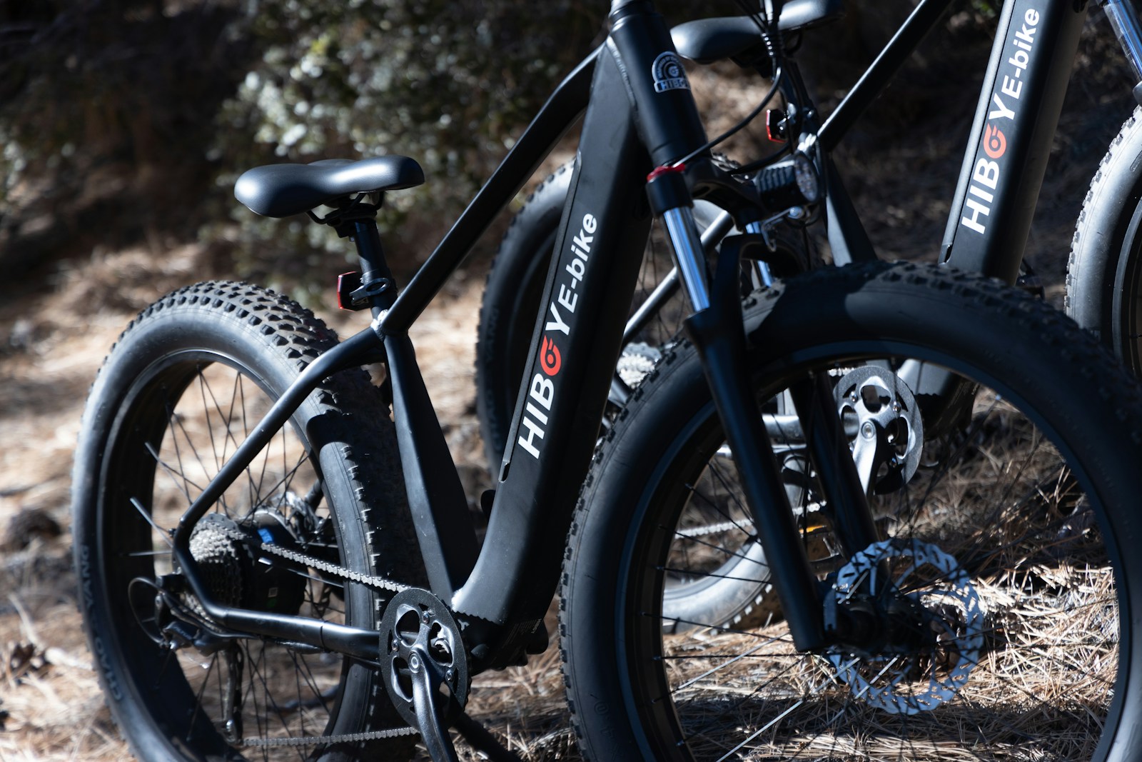 a black bicycle with a blue handlebars